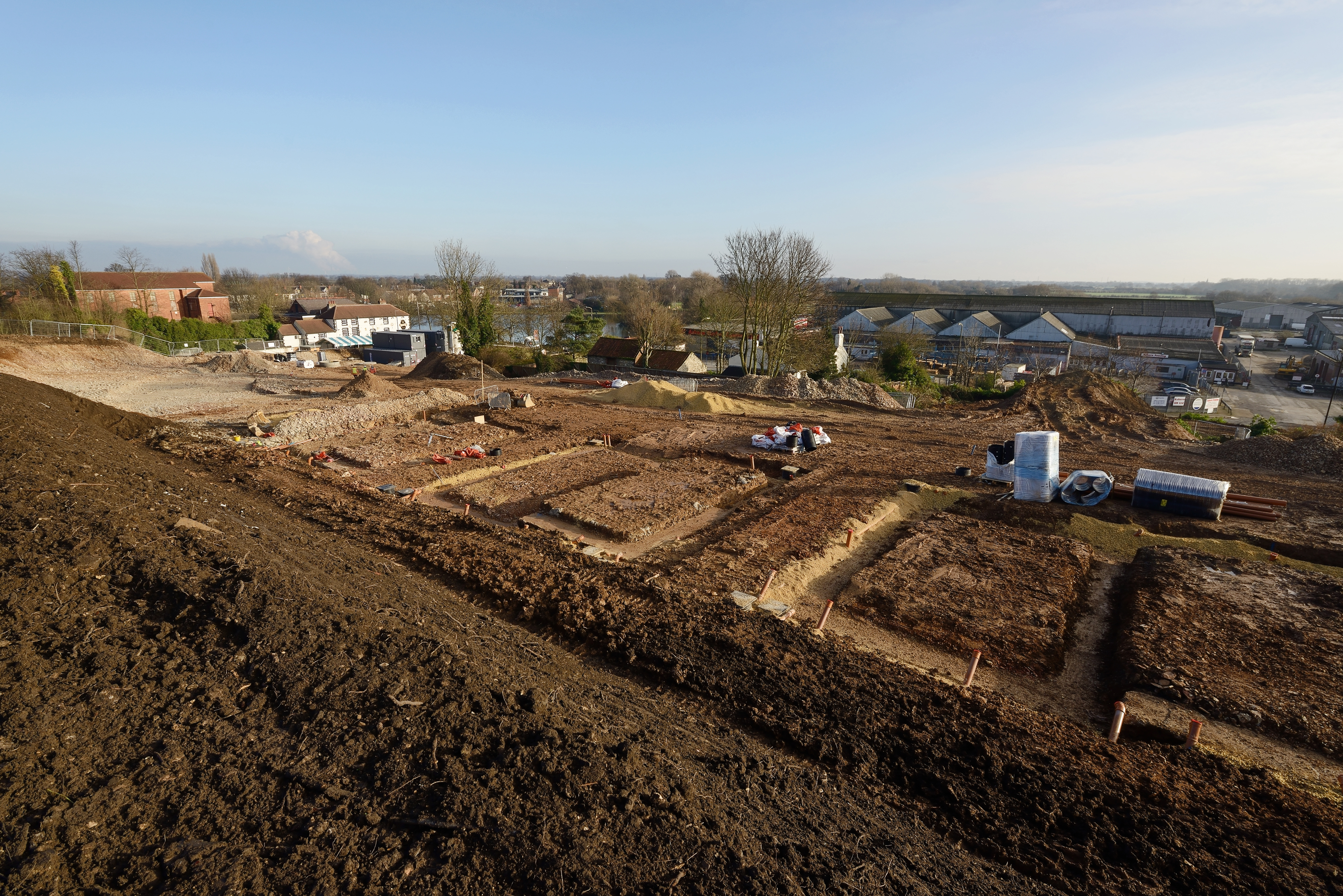 A building site. The footings and below ground drainage products are being dug out and installed.