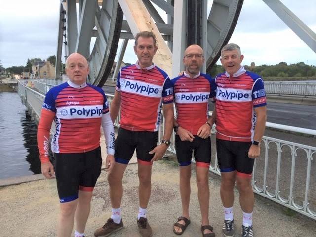 Regional Sales Manager Gary Foord stands in cycling attire by a bridge in France before his Challenge Adventure Charity Cycle Challenge to Mont Ventoux begins.