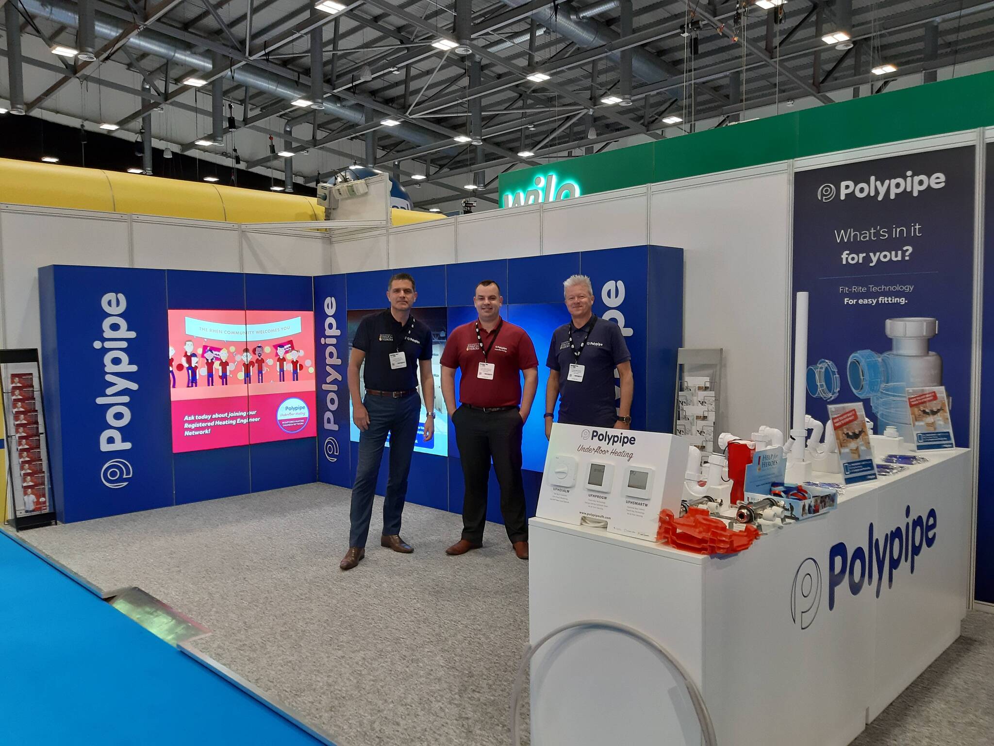Three of Polypipe's Area Heating Managers stood on the Polypipe Stand at Installer 2019.