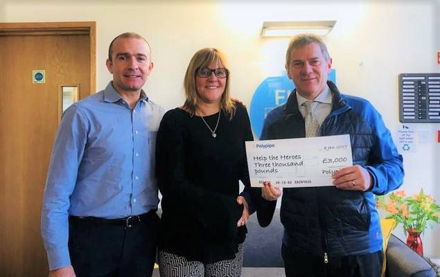 Peter Fletcher receives a cheque to be donated to Help for Heroes